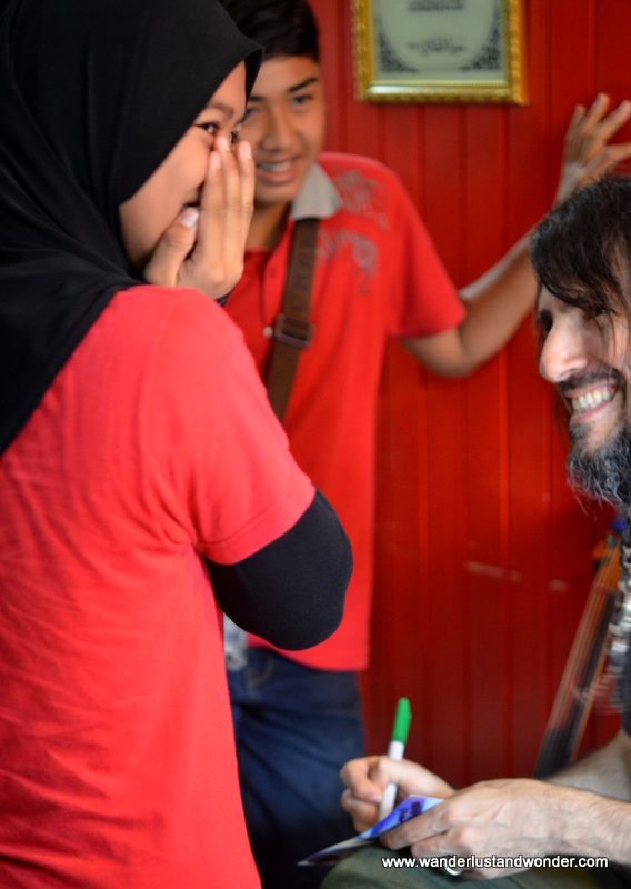 Ron Thal made sure that each child's name was spelled correctly, and tried to get each to laugh.